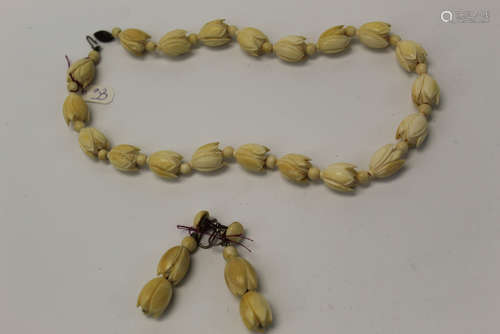 A Set of Chinese carved bone necklace and earrings.