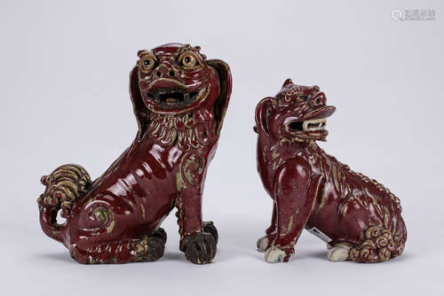 Two Chinese red glaze pottery figures of lion.