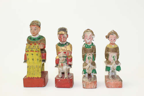 A group of four Chinese wood figurines