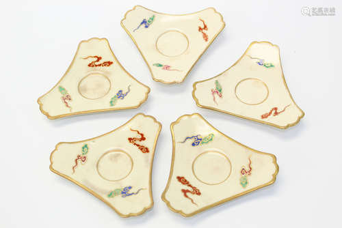 Five Japanese hand painted porcelain cup holders.