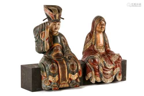 A PAIR OF CARVED WOODEN FIGURES OF BUDDHIST DEITIE
