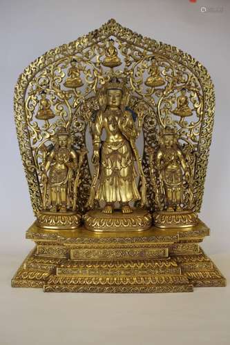 A GILT-BRONZE FIGURE OF A GROUP OF BUDDHAS