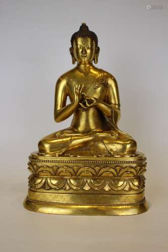 A GILT-BRONZE FIGURE OF SAKYAMUNI