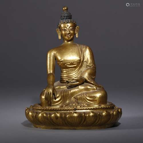 A GILT-BRONZE FIGURE OF SHAKYAMUNI