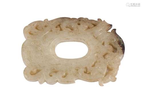A Chinese pale green and russet jade archaistic oval plaque