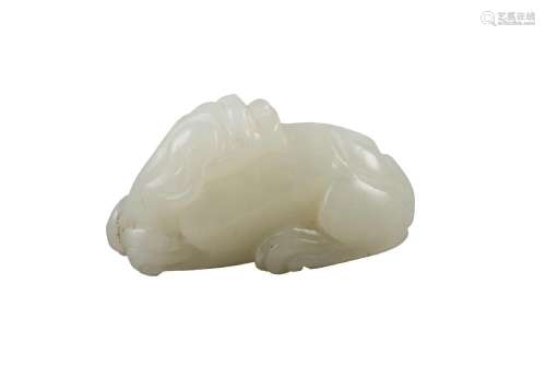 A Chinese pale green jade lion pendant