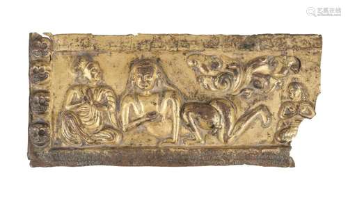 A Tibetan gilt copper repousse plaque