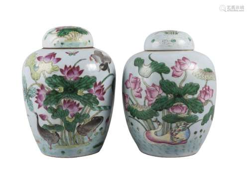 A pair of large Chinese porcelain 'lotus pond' jars and covers