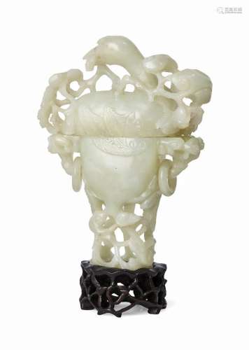 A Chinese pale green jade vase and cover