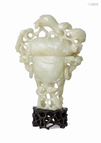 A Chinese pale green jade vase and cover