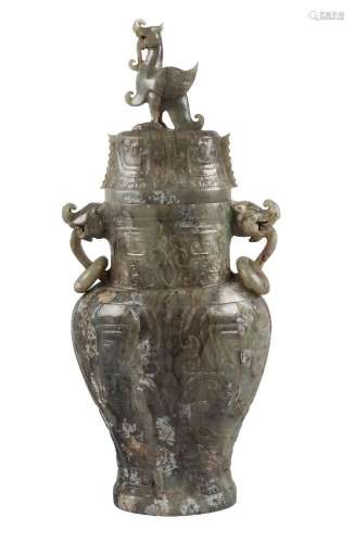 A Chinese green hardstone archaistic vase and cover