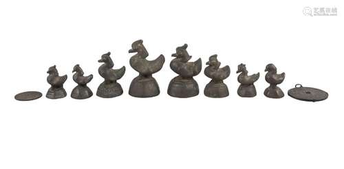 A set of eight chicken form opium weights