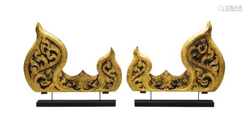 A pair of Thai carved giltwood 'jewelled' flame panels