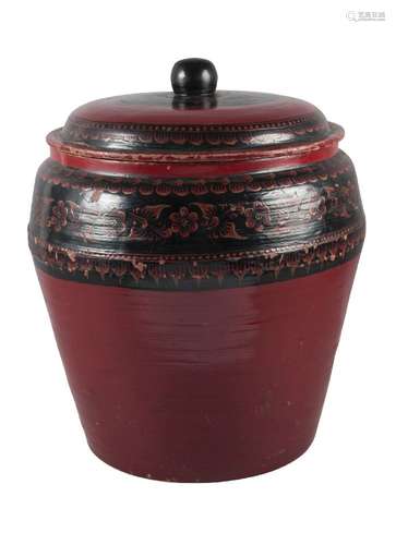 A Burmese red painted papier maché jar and cover