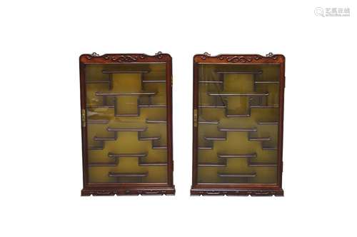 A pair of Chinese hardwood display cabinets