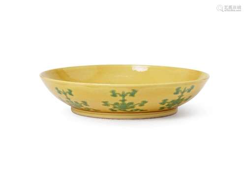 A Chinese porcelain yellow-glazed saucer dish