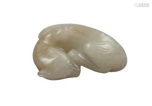A Chinese green hardstone dog carving