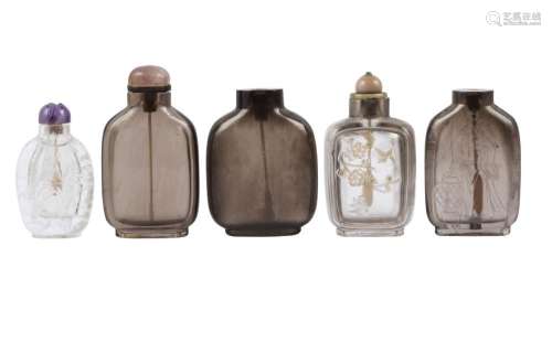 Five Chinese smokey glass and rock crystal snuff bottles
