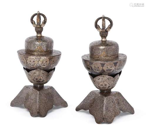 A pair of Tibetan iron ritual cups and stands