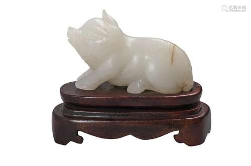 A Chinese carved white jade pig