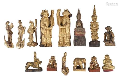 A collection of carved gilt wood figures and animals