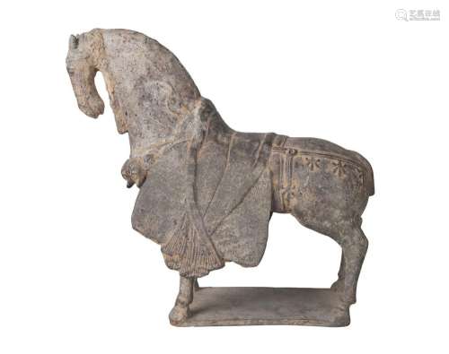 A Chinese finely modelled grey pottery figure of a caparisoned horse