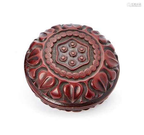 A rare Chinese cinnabar lacquer circular 'lotus' box and cover