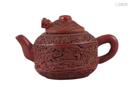 A Chinese cinnabar lacquer encased Yixing teapot