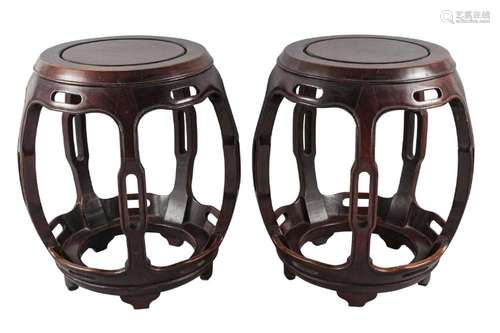 A pair of Chinese hardwood barrel form stools