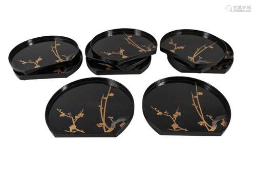 A set of ten Japanese lacquer demi lune trays