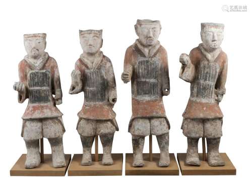 Four large Chinese grey stoneware guardian figures