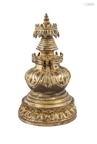 A Tibetan gilt jeweled bronze stupa