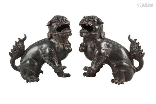A pair of Chinese iron Buddhist lion censers
