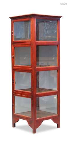 A red painted square freestanding glazed display cabinet