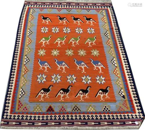 Tapis Kilim Kashgaî. Le fond, orange, présente des...