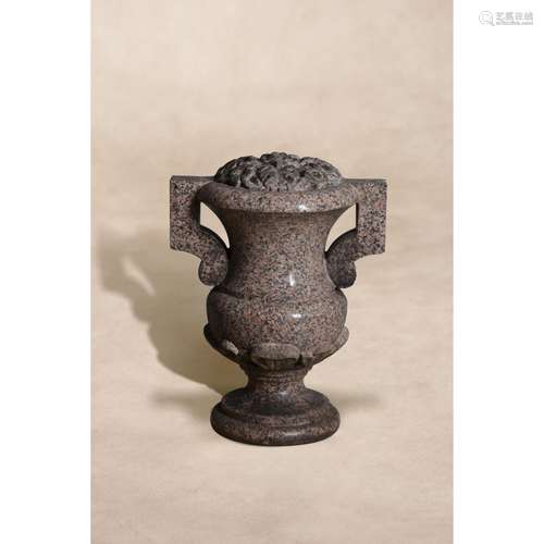 A Victorian carved Peterhead granite twin handled urn