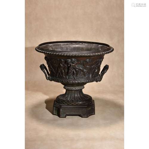 A Continental patinated bronze twin handled urn