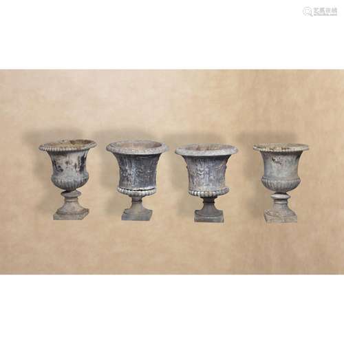 Two pairs of cast lead garden urns