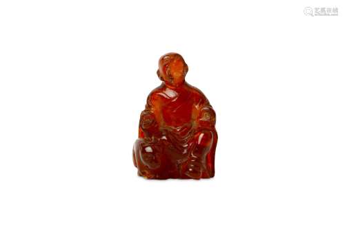 A CHINESE AMBER CARVING OF A WITH A TIGER.