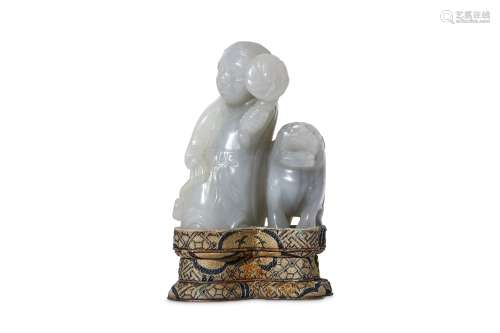 A CHINESE JADE 'BOY AND LION' CARVING. 19th