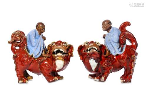 A PAIR OF CHINESE SHIWAN FIGURES ON LIONS.