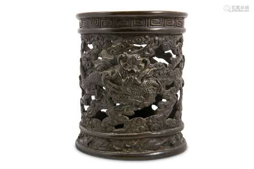 A CHINESE BRONZE ‘DRAGON’ INCENSE-STICK HOLDER. 17