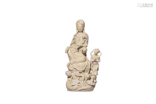 A CHINESE BLANC DE CHINE GUANYIN AND CHILD.