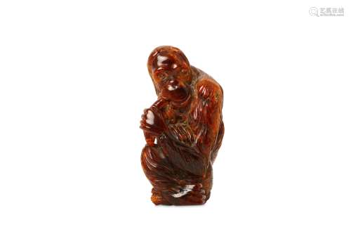A CHINESE AMBER CARVING OF A MONKEY. Qing Dynasty