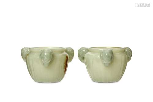 A PAIR OF CHINESE JADE WASHERS WITH ELEPHANT HEAD HANDLES. 20th Century. Each with rounded