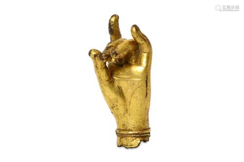 A GILT BRONZE LEFT HAND. 17th Century. Held in kar