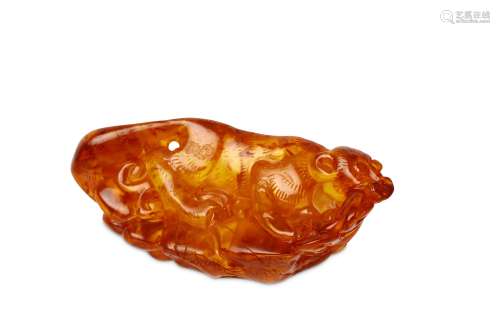 A CHINESE AMBER 'SQUIRREL AND GRAPES' CARVING. Qin