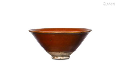 A CHINESE PERSIMMON-COLOUR STONEWARE TEA BOWL. Son