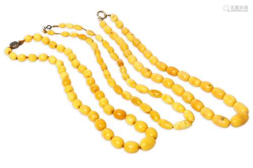 THREE AMBER NECKLACES. Three graduated strands of