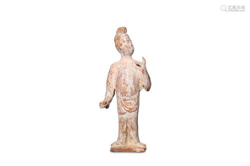 A CHINESE UNGLAZED STANDING FIGURE. Tang Dynasty.